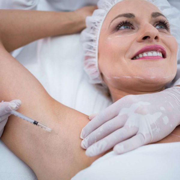 doctor-injecting-woman-her-arm-pits